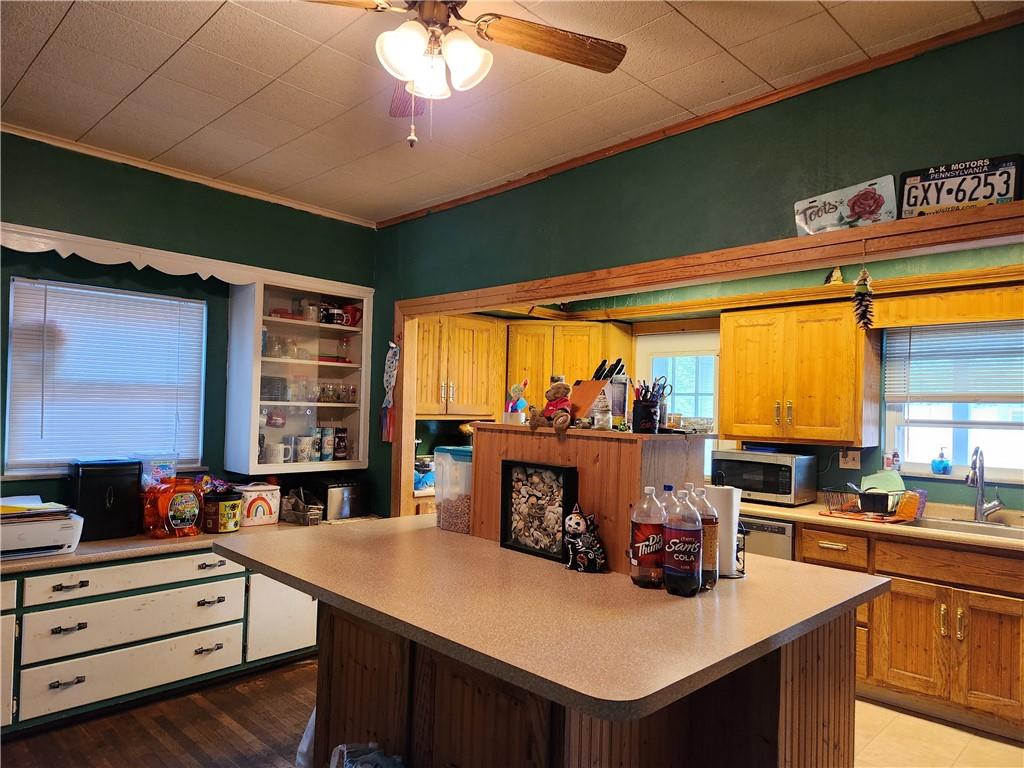 302 South Second Street Apollo, PA 15613 - Photo 8 of 15 a kitchen with stainless steel appliances granite countertop a sink counter space and a window