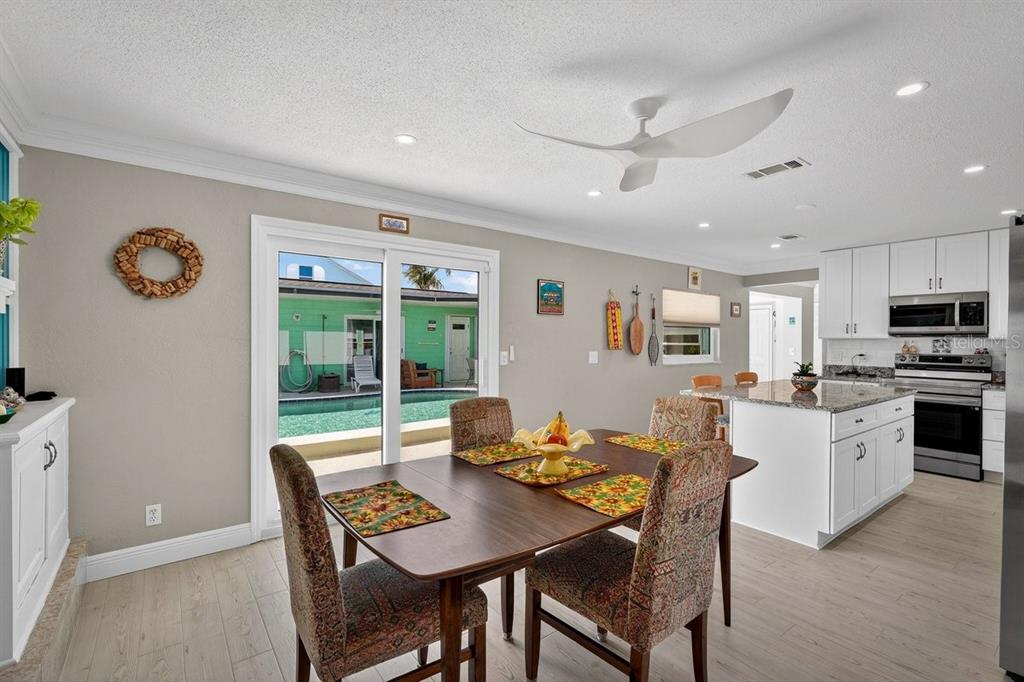 119 Carriage Ponce Inlet, FL 32127 - Photo 16 of 67 a view of a dining room with furniture and a table