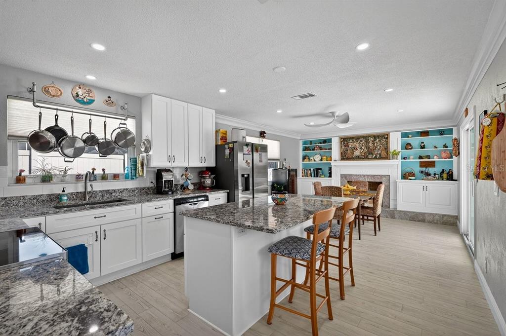 119 Carriage Ponce Inlet, FL 32127 - Photo 17 of 67 a kitchen with stainless steel appliances kitchen island granite countertop a sink and cabinets