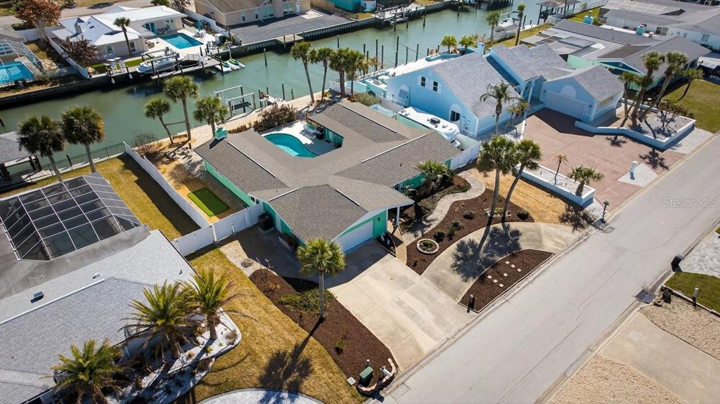 119 Carriage Ponce Inlet, FL 32127 - Photo 2 of 67 an aerial view of a house with outdoor space and lake view