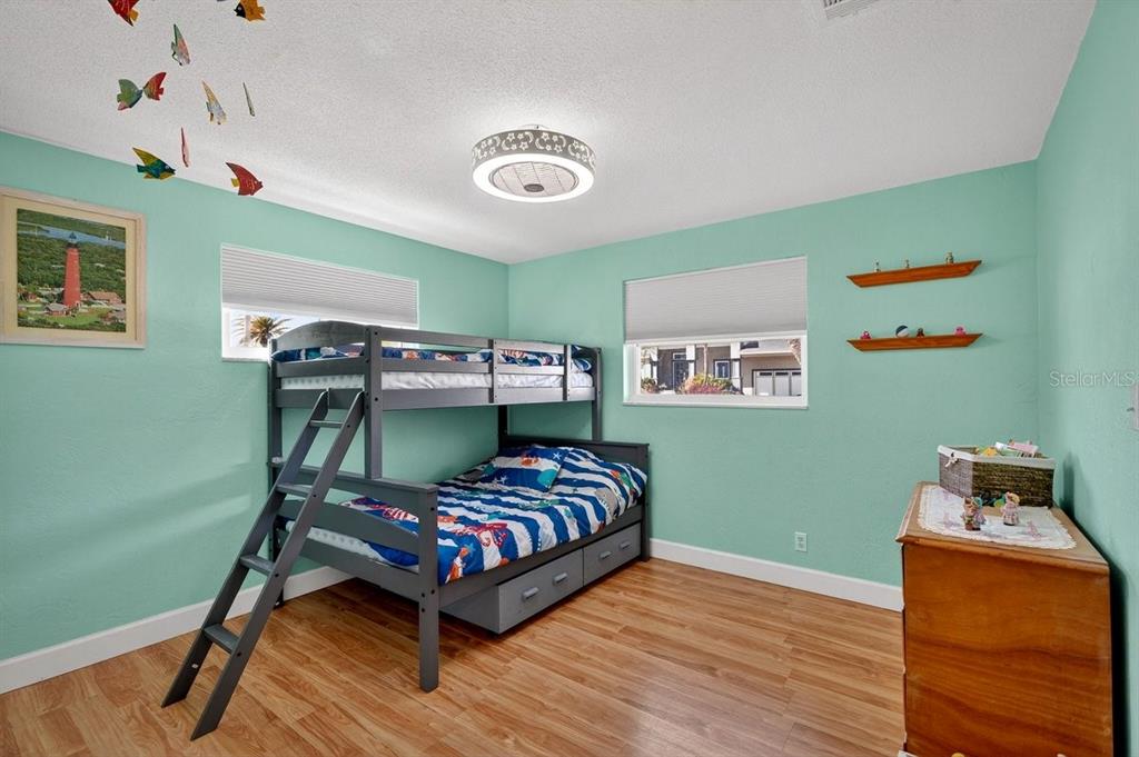 119 Carriage Ponce Inlet, FL 32127 - Photo 21 of 67 a bedroom with a bed and wooden floor