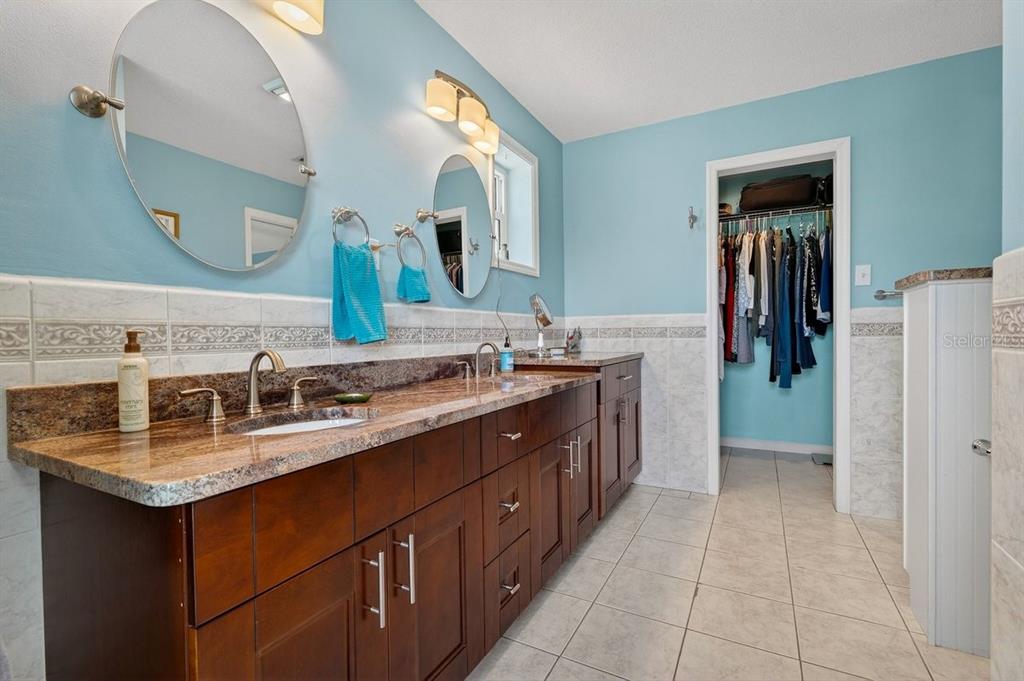 119 Carriage Ponce Inlet, FL 32127 - Photo 29 of 67 a bathroom with a sink vanity and mirror