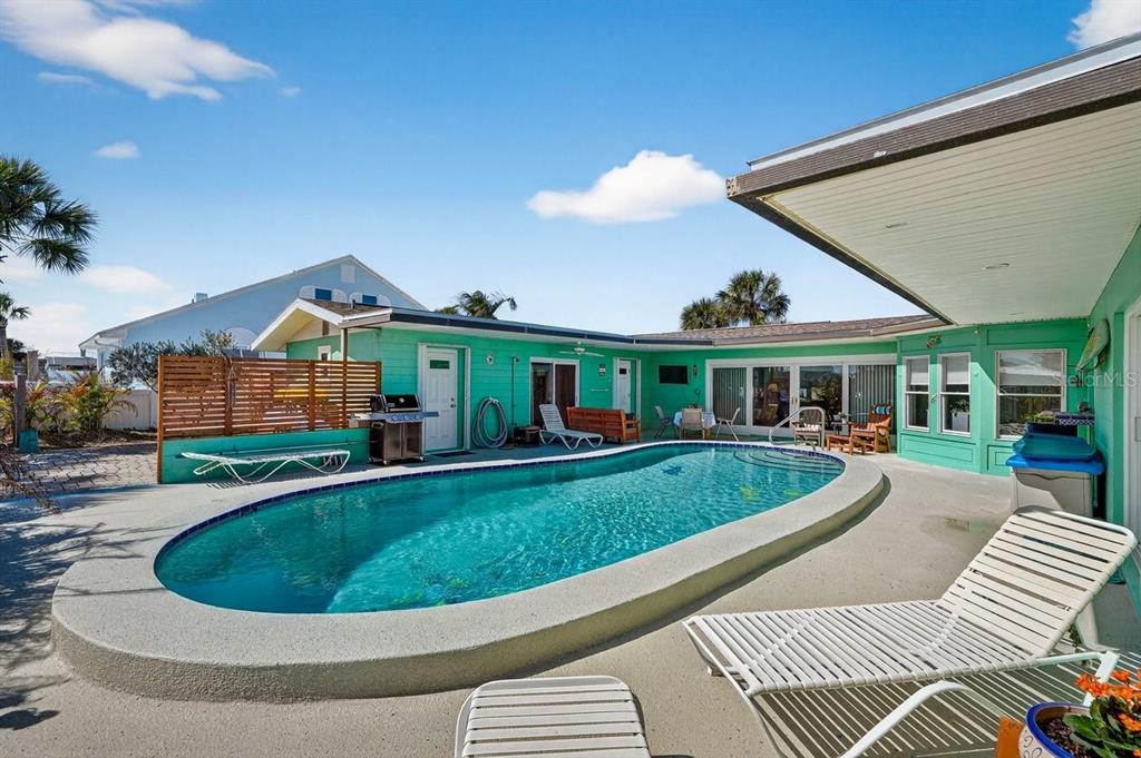 119 Carriage Ponce Inlet, FL 32127 - Photo 50 of 67 a front view of a house with a yard and porch