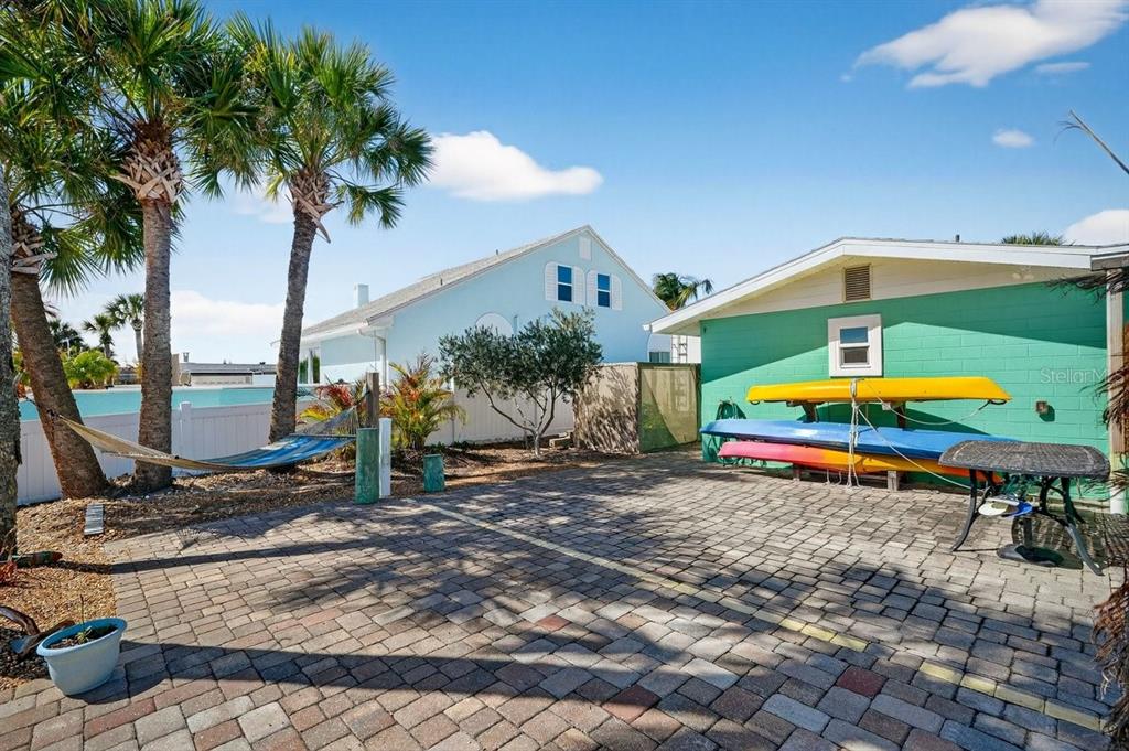 119 Carriage Ponce Inlet, FL 32127 - Photo 53 of 67 a backyard of a house with table and chairs
