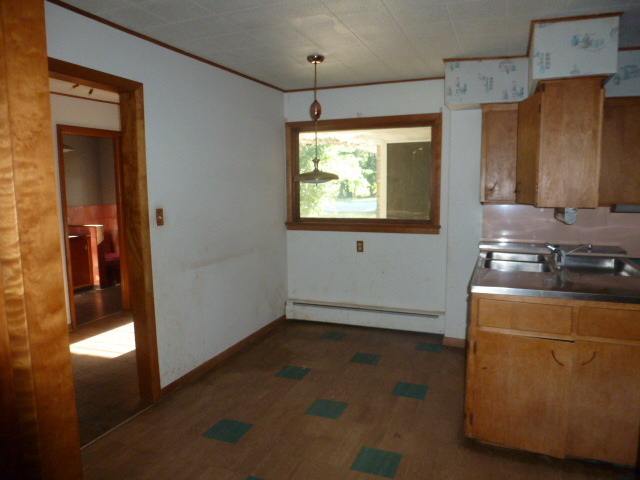 19659 West Manhattan Road Elwood, IL 60421 - Photo 12 of 25 a view of a room with wooden floor and cabinet