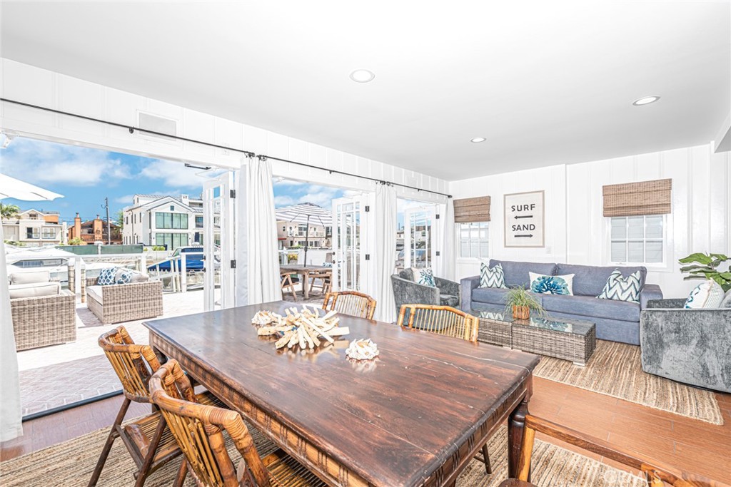 3717 Channel Place Newport Beach, CA 92663 - Photo 11 of 41 a view of a dining room with furniture and wooden floor