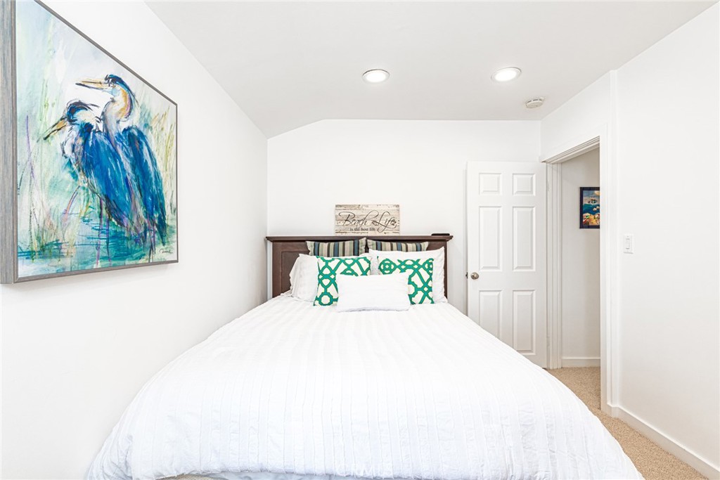3717 Channel Place Newport Beach, CA 92663 - Photo 14 of 41 a bedroom with a bed and a painting on the wall