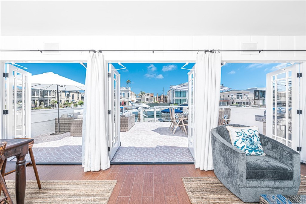 3717 Channel Place Newport Beach, CA 92663 - Photo 2 of 41 a living room with furniture and a rug