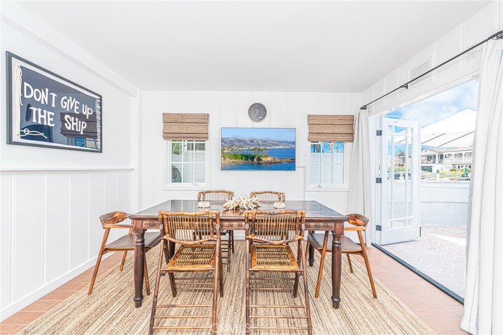 3717 Channel Place Newport Beach, CA 92663 - Photo 26 of 41 a dining room with furniture and wooden floor