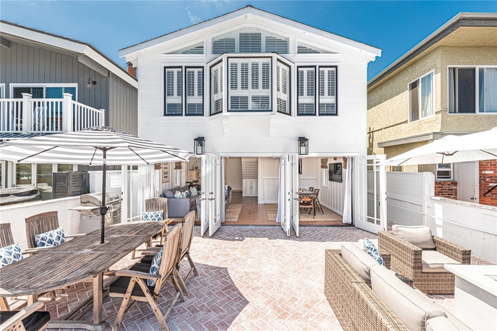 3717 Channel Place Newport Beach, CA 92663 - Photo 3 of 41 a front view of a house with a porch