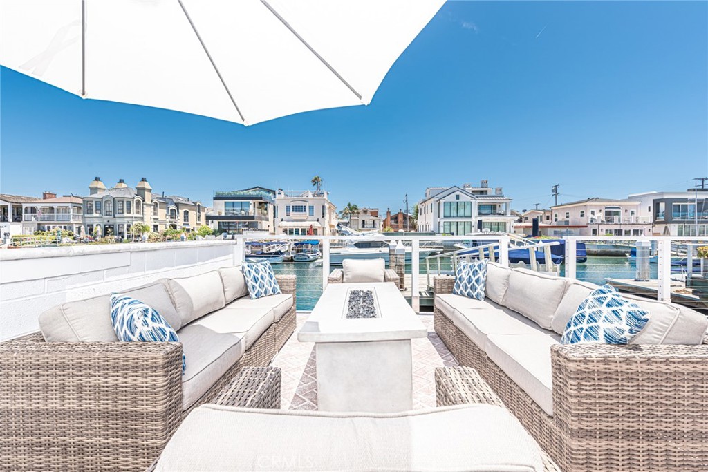 3717 Channel Place Newport Beach, CA 92663 - Photo 5 of 41 a view of a roof deck with couches and potted plants
