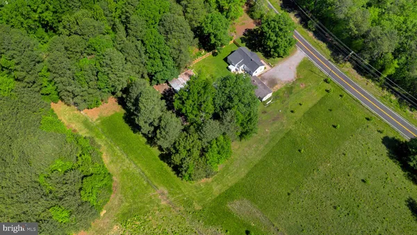 an aerial view of residential house with an outdoor space