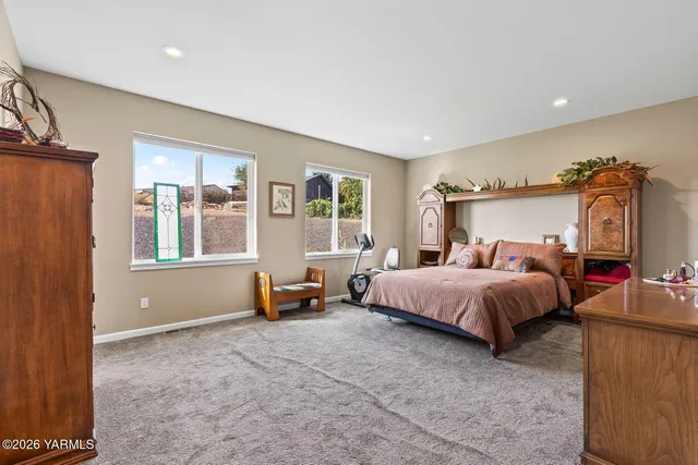 a bedroom with bed and window
