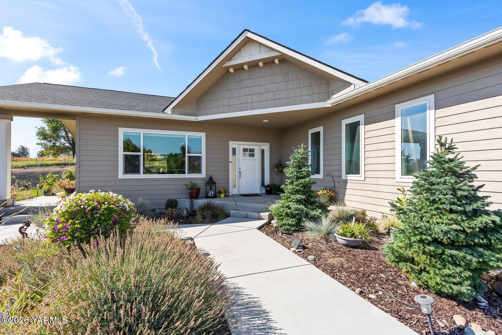 801 Lancaster Road Selah, WA 98942 - Photo 3 of 20 a view of house with patio outdoor seating and entertaining space