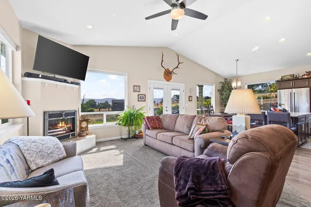 a living room with furniture fireplace and a flat screen tv