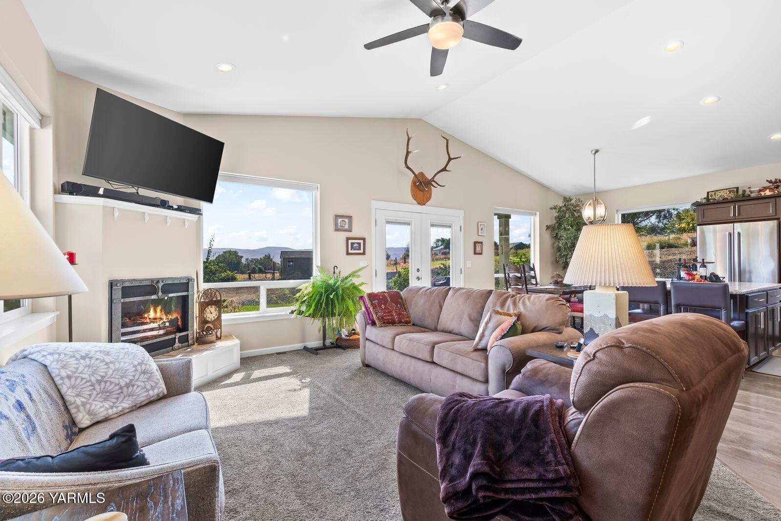 801 Lancaster Road Selah, WA 98942 - Photo 5 of 20 a living room with furniture fireplace and a flat screen tv
