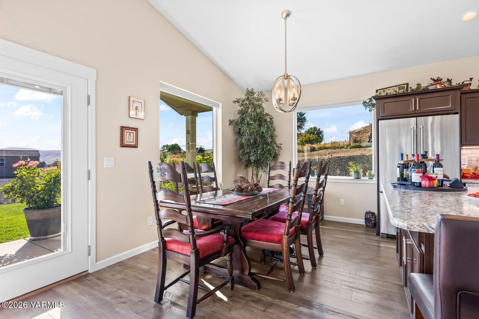 801 Lancaster Road Selah, WA 98942 - Photo 7 of 20 a view of a dining room with furniture window and wooden floor