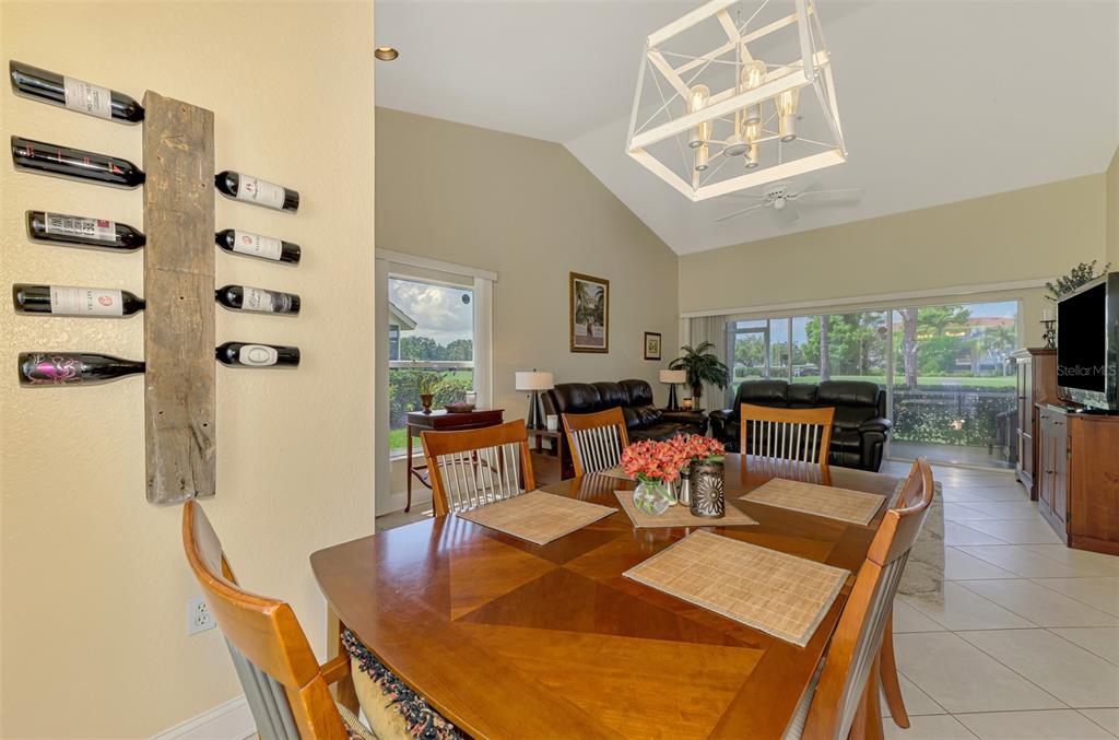 6546 Fairway Gardens Drive, Unit 6546 Bradenton, FL 34203 - Photo 11 of 70 a living room with furniture a flat screen tv and a table