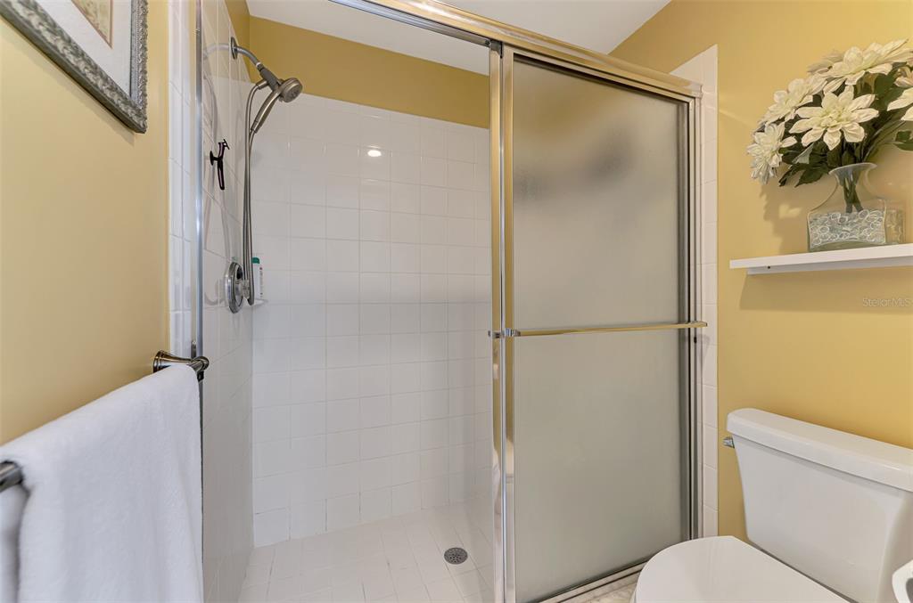 6546 Fairway Gardens Drive, Unit 6546 Bradenton, FL 34203 - Photo 27 of 70 a bathroom with a shower and a toilet
