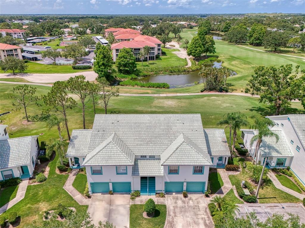 6546 Fairway Gardens Drive, Unit 6546 Bradenton, FL 34203 - Photo 36 of 70 an aerial view of a house with a garden