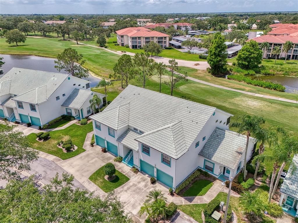 6546 Fairway Gardens Drive, Unit 6546 Bradenton, FL 34203 - Photo 37 of 70 an aerial view of a house with outdoor space and a lake view