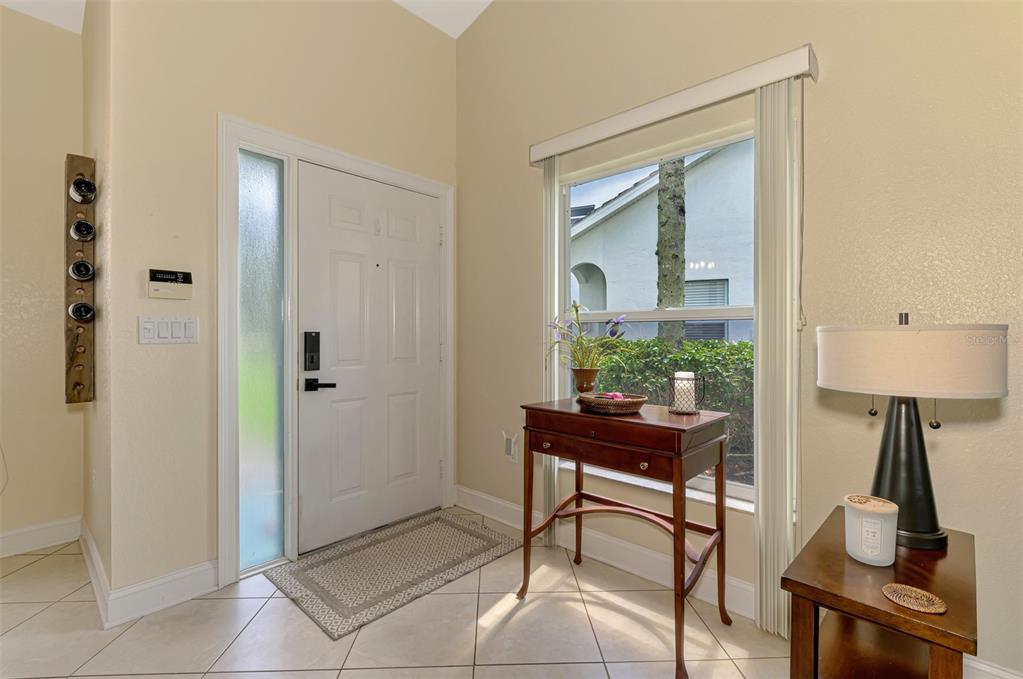 6546 Fairway Gardens Drive, Unit 6546 Bradenton, FL 34203 - Photo 4 of 70 a view of a workspace room with wooden floor and a table