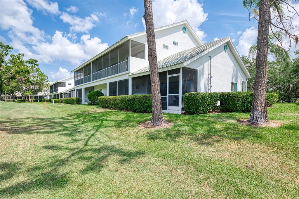6546 Fairway Gardens Drive, Unit 6546 Bradenton, FL 34203 - Photo 41 of 70 a view of a house with a big yard and potted plants