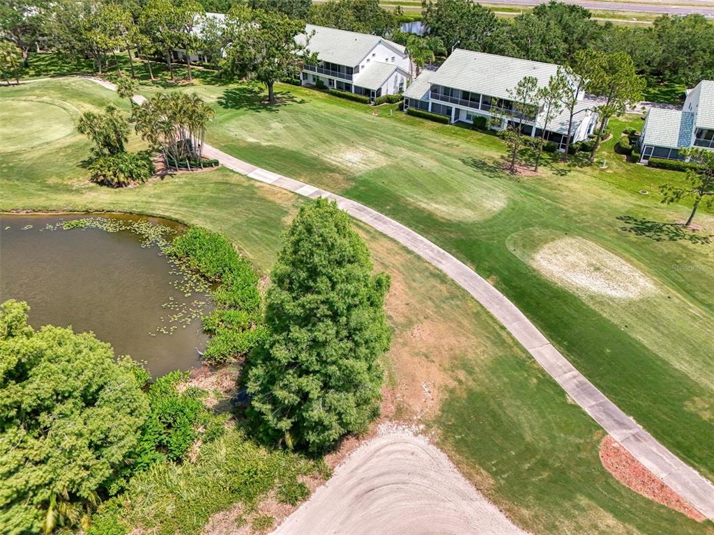 6546 Fairway Gardens Drive, Unit 6546 Bradenton, FL 34203 - Photo 47 of 70 an aerial view of residential houses with outdoor space
