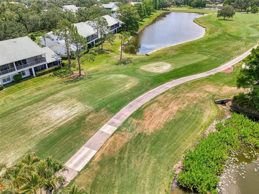 6546 Fairway Gardens Drive, Unit 6546 Bradenton, FL 34203 - Photo 50 of 70 an aerial view of residential houses with outdoor space and trees
