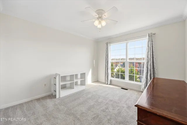 a balcony with wooden floor and city view