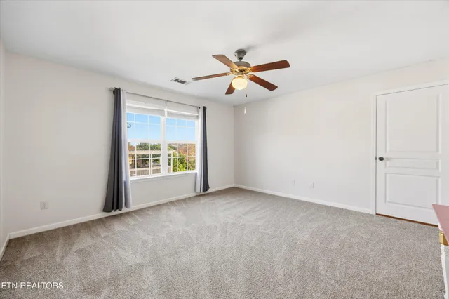 a view of a livingroom with a ceiling fan
