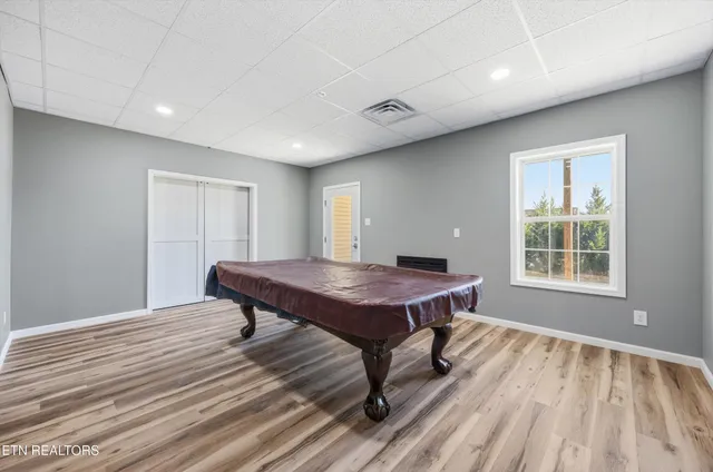 a view of a room with balcony and ocean view
