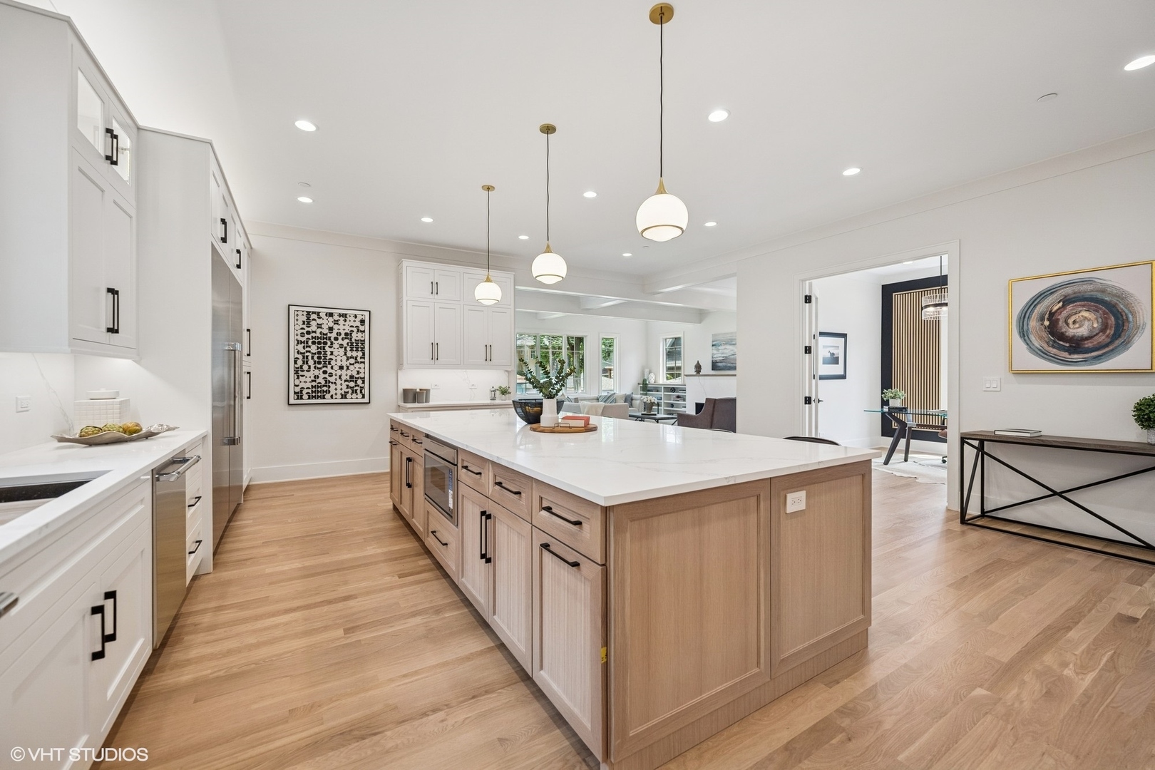 3811 North Kildare Avenue Chicago, IL 60641 - Photo 20 of 126 a large kitchen with stainless steel appliances kitchen island a large counter top a sink a stove and a refrigerator