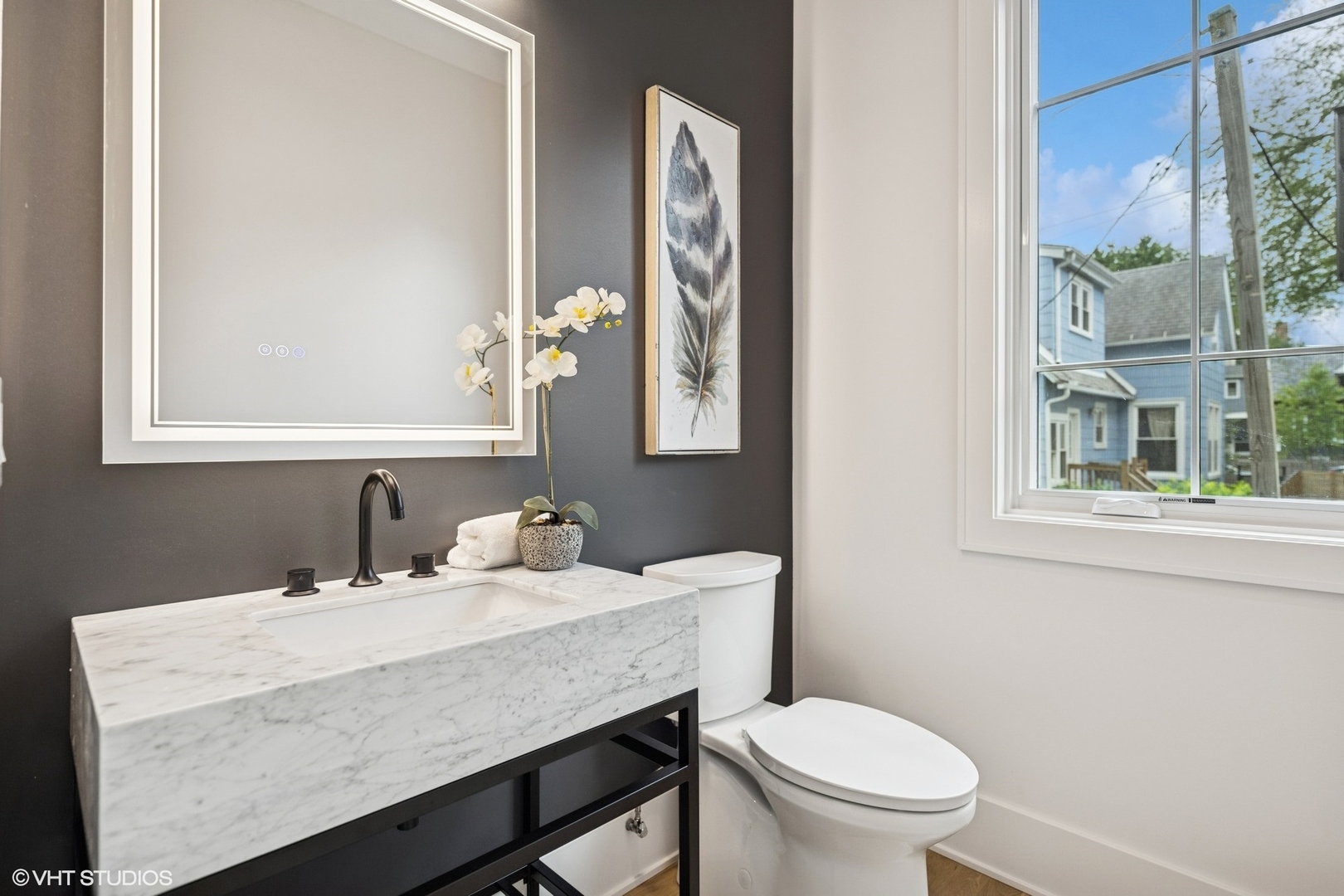 3811 North Kildare Avenue Chicago, IL 60641 - Photo 26 of 126 a bathroom with a granite countertop toilet sink and mirror