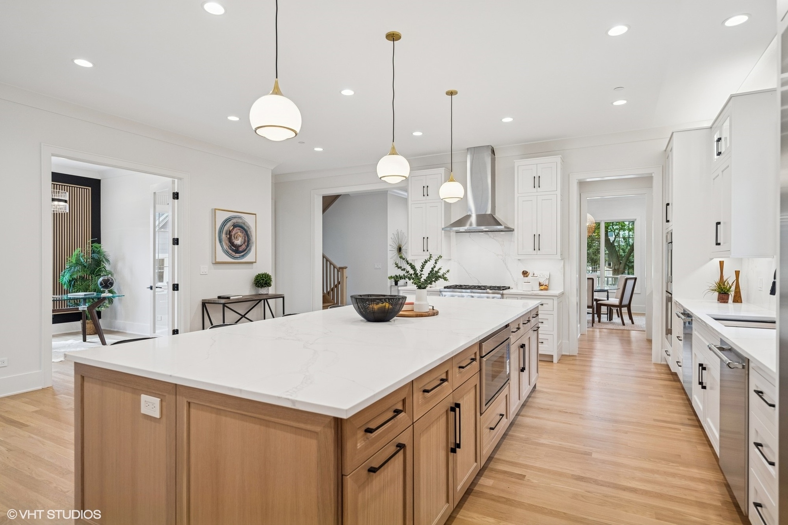 3811 North Kildare Avenue Chicago, IL 60641 - Photo 30 of 126 a kitchen with kitchen island a sink and a stove