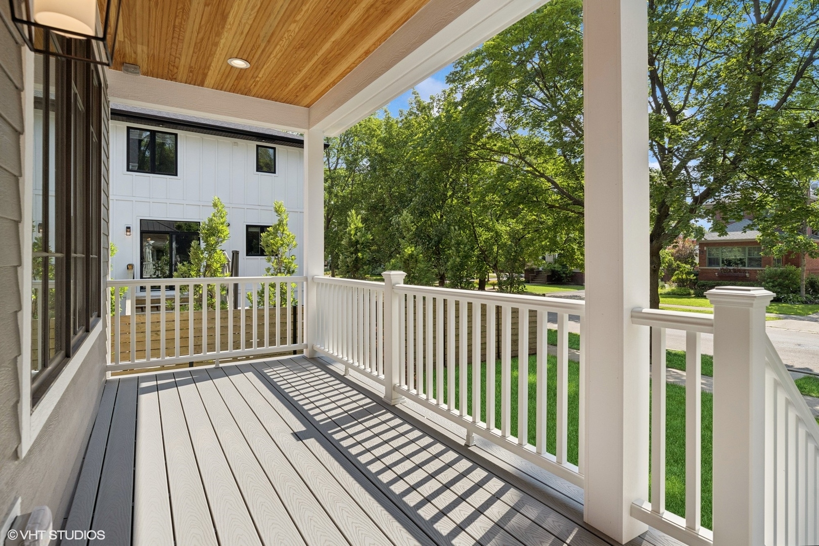3811 North Kildare Avenue Chicago, IL 60641 - Photo 5 of 126 a view of a wooden deck and a yard with wooden fence