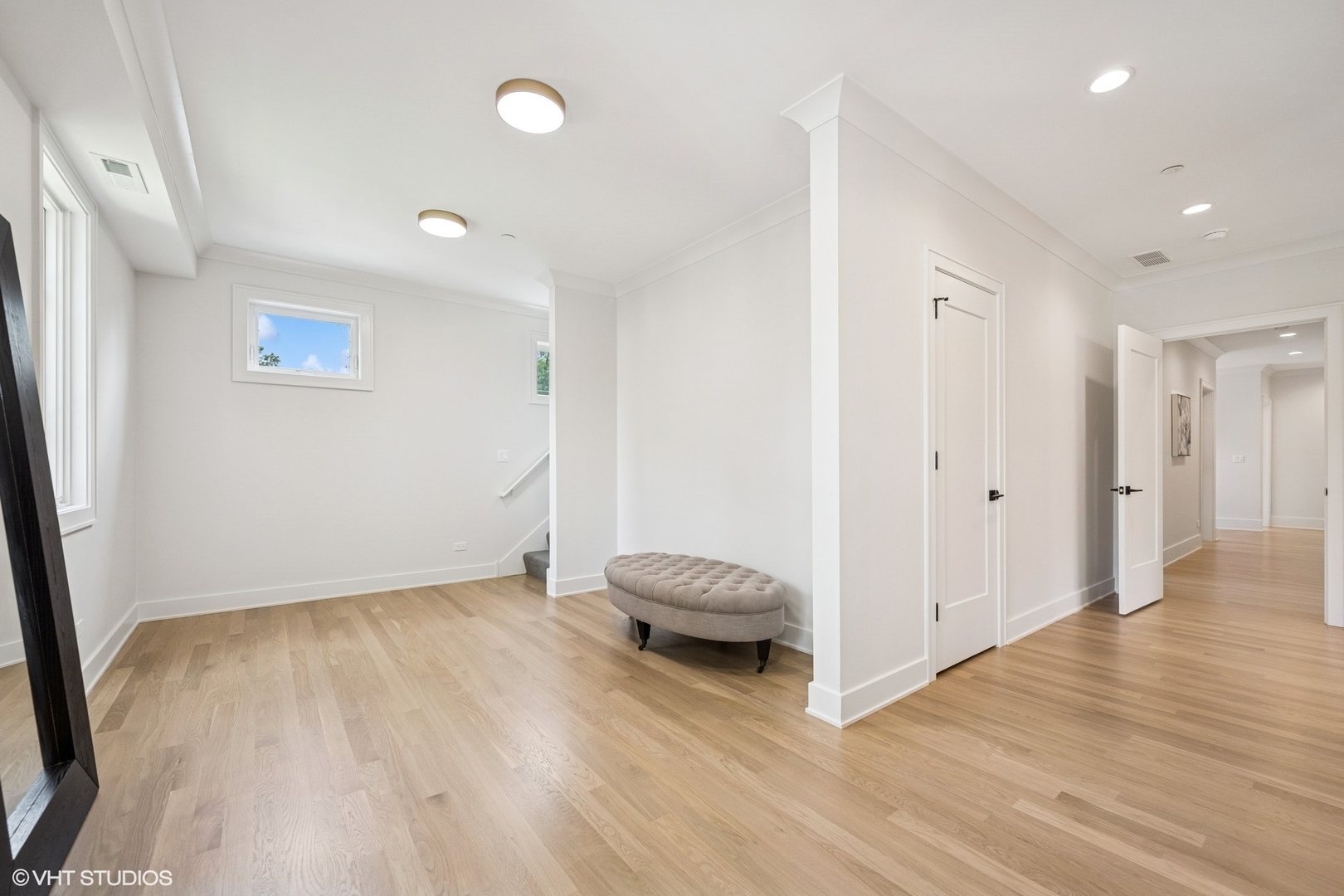 3811 North Kildare Avenue Chicago, IL 60641 - Photo 73 of 126 a view of a hallway to a room with wooden floor and cabinet