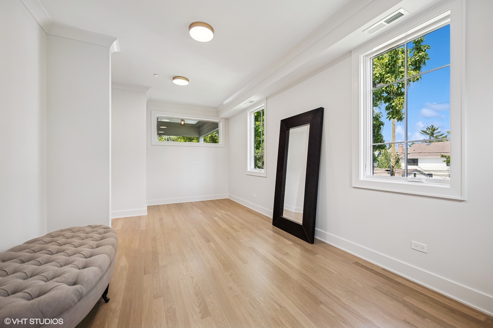 3811 North Kildare Avenue Chicago, IL 60641 - Photo 74 of 126 wooden floor in an empty room with a window