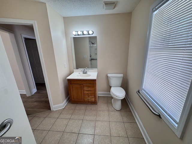 156 Torrance Road Southwest Milledgeville, GA 31061 - Photo 12 of 16 a bathroom with a toilet a sink and a mirror