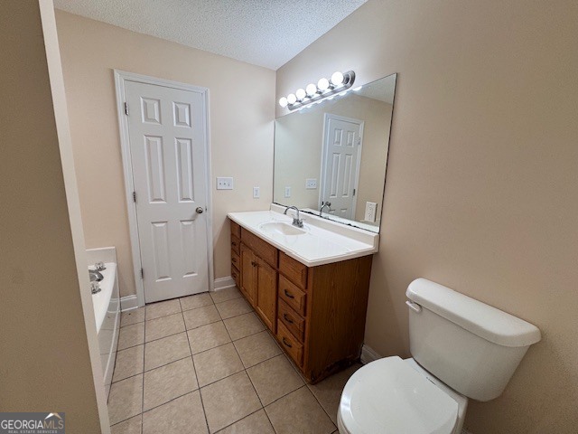 156 Torrance Road Southwest Milledgeville, GA 31061 - Photo 14 of 16 a bathroom with a sink a toilet and mirror