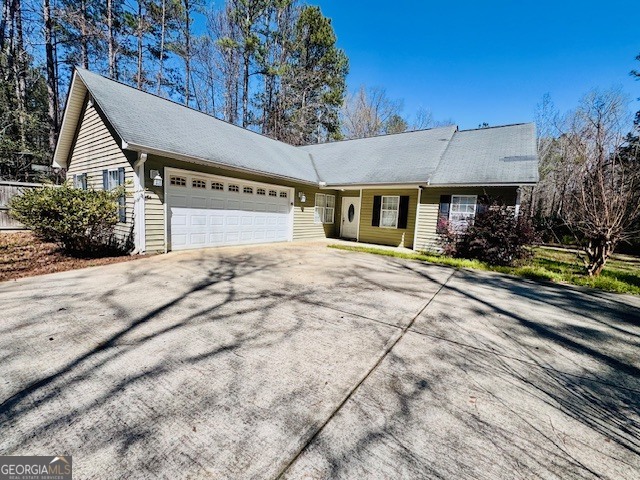 156 Torrance Road Southwest Milledgeville, GA 31061 - Photo 2 of 16 a front view of a house with a yard
