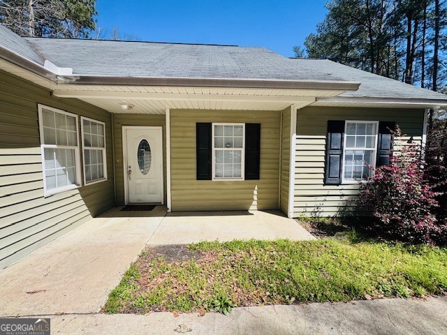 156 Torrance Road Southwest Milledgeville, GA 31061 - Photo 3 of 16 a view of a house with potted plants