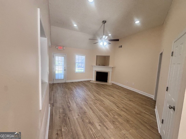 156 Torrance Road Southwest Milledgeville, GA 31061 - Photo 5 of 16 an empty room with wooden floor and windows