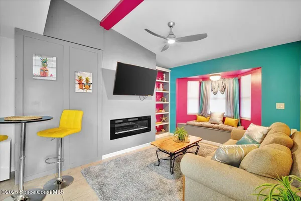 a kitchen with stainless steel appliances granite countertop a refrigerator a stove a sink dishwasher and a dining table with wooden floor
