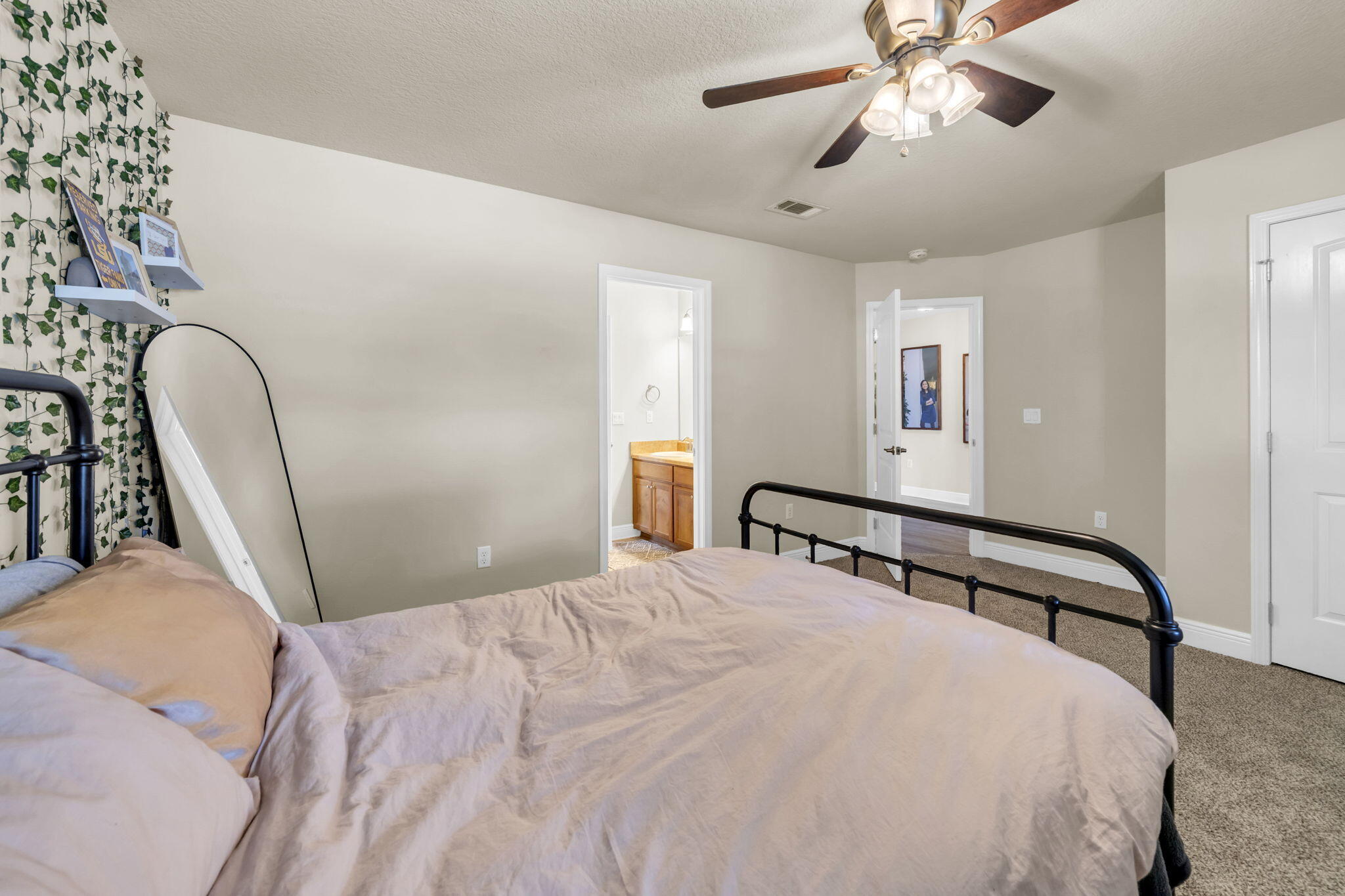 217 Raptor Drive Crestview, FL 32536 - Photo 32 of 48 a bedroom with a bed and a chandelier