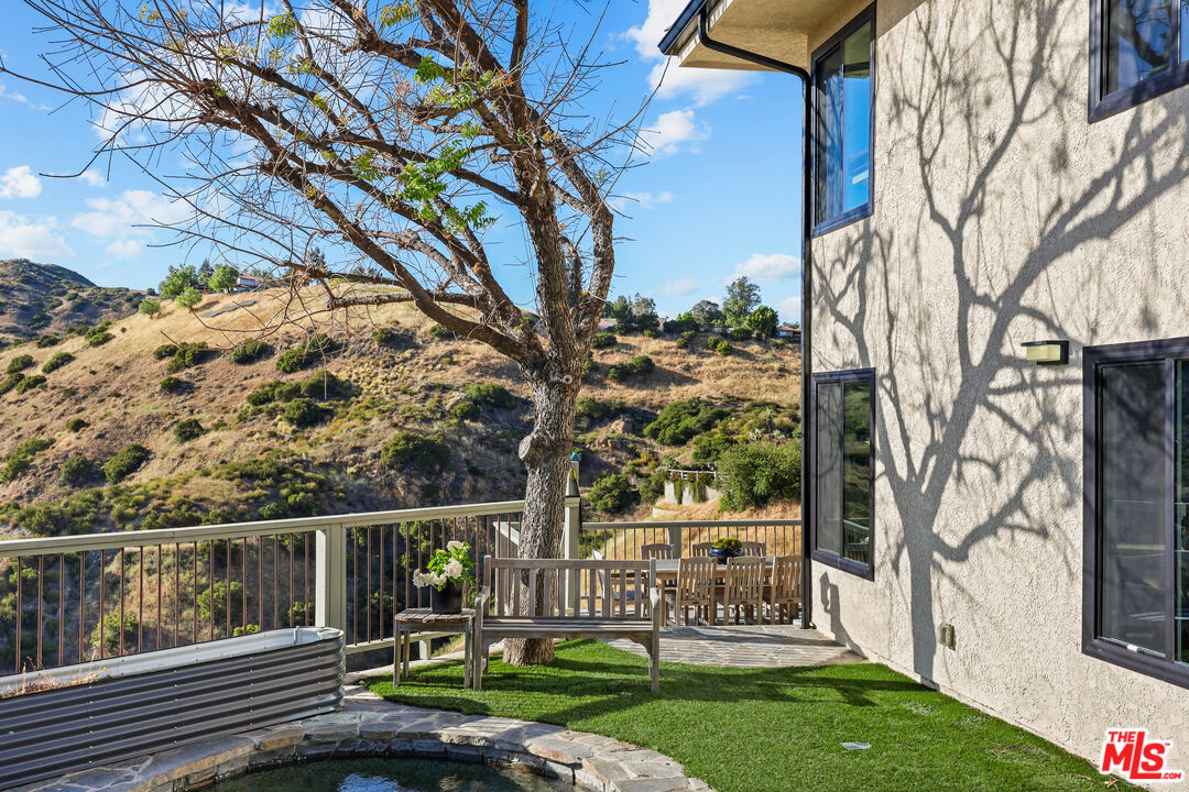 53 Saddlebow Road Bell Canyon, CA 91307 - Photo 57 of 66 a view of a house with backyard and sitting area