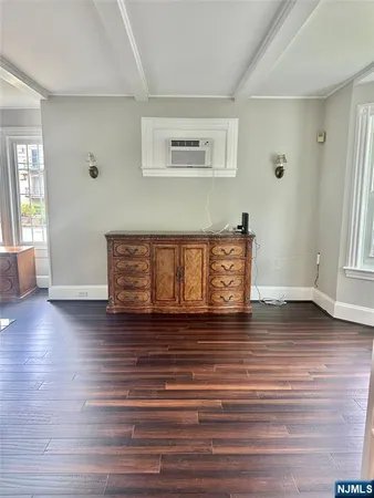a view of a livingroom with wooden floor