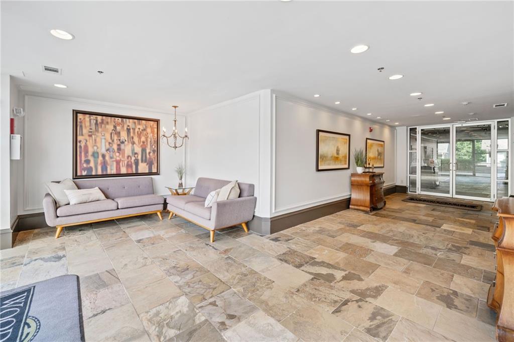 360 Chambers Street, Unit 210 Woodstock, GA 30188 - Photo 23 of 36 a living room with furniture and a window