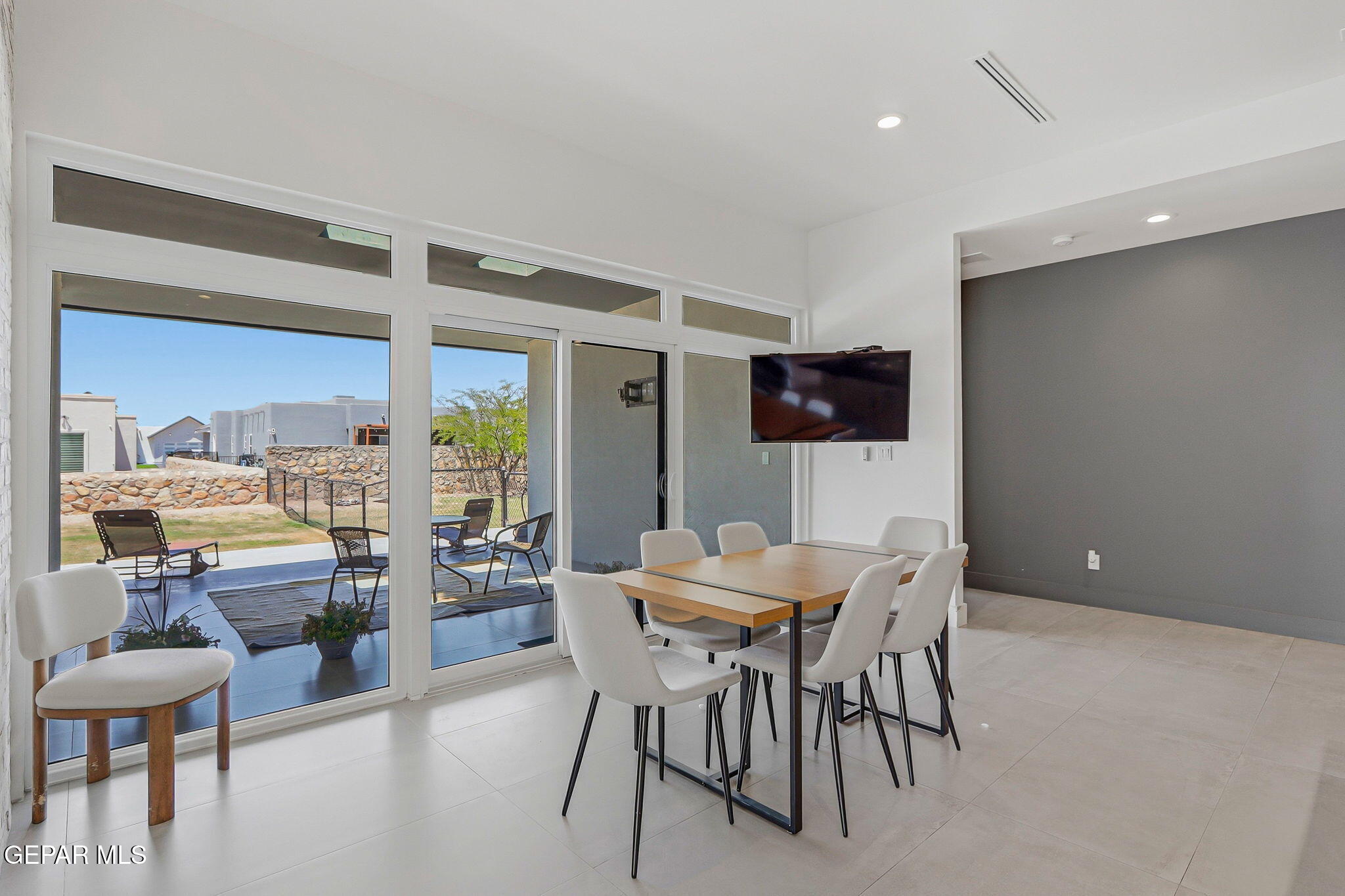329 Rio El Rancho Court El Paso, TX 79932 - Photo 17 of 47 a view of a dining room with furniture and wooden floor