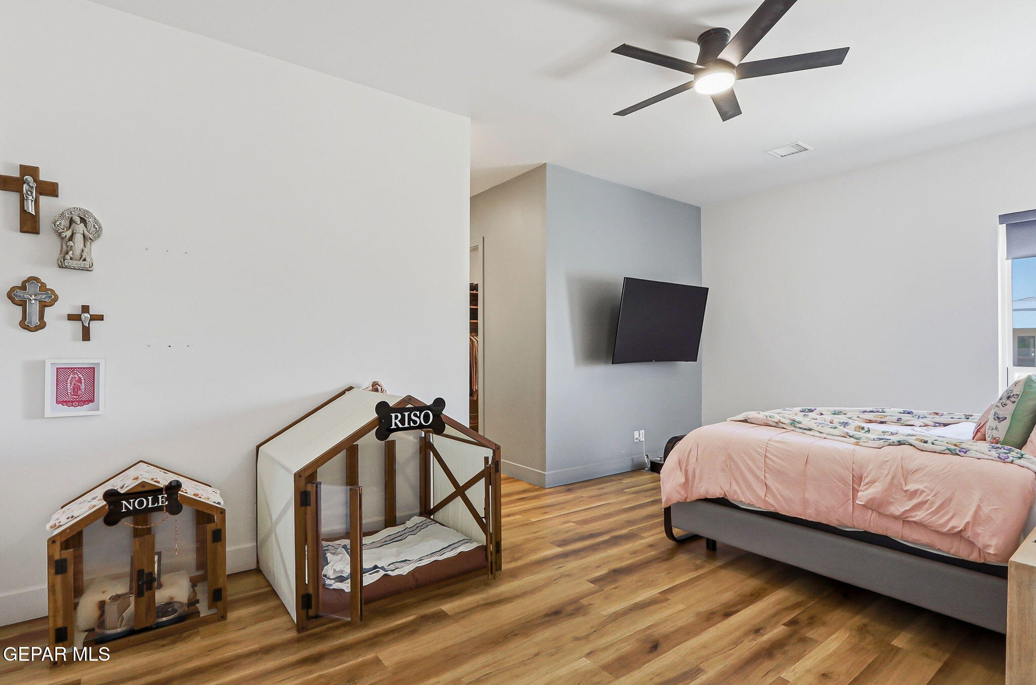 329 Rio El Rancho Court El Paso, TX 79932 - Photo 18 of 47 a bedroom with a bed and a chandelier